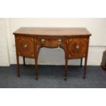 A George III mahogany bachelors chest, the crossbanded rectangular top over brushing slide and
