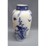 Minton's, an early 20th century floor vase, decorated in underglaze blue with a perched