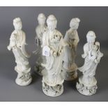 A collection of five 20th century Chinese blanc de chine porcelain figures of Gaunyin, on lotus