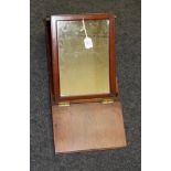 A 19th century teakwood folding campaign shaving mirror, fitted with a pair of panel doors, 43 x