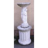A reconstituted stone Three Graces birdbath, on an associated fluted squat column plinth, 134cm