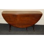 A 19th century mahogany wake type gateleg dining table, the rectangular top and twin demi-lune flaps