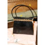 An Aspreys black crocodile handbag