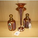 A near pair of Bohemian red/white overlay scent bottles, each with gilded spherical stopper, and