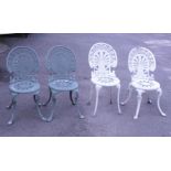 A set of four aluminium garden chairs, each with anthemion back, pierced circular seat, on splayed