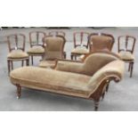 A Victorian carved walnut nine piece salon suite, comprising chaise longue, six single chairs,