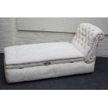 A traditionally buttoned florally upholstered day bed ottoman with rolled end and rising seat, 76