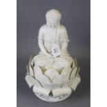 A 20th century Chinese blanc de chine porcelain figure of a seated Buddha on a lotus throne, 37cm