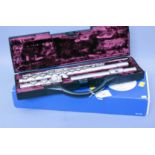 A cased Buffet Albert Cooper flute, serial number 694237, retailed by Boosey and Hawks Ltd