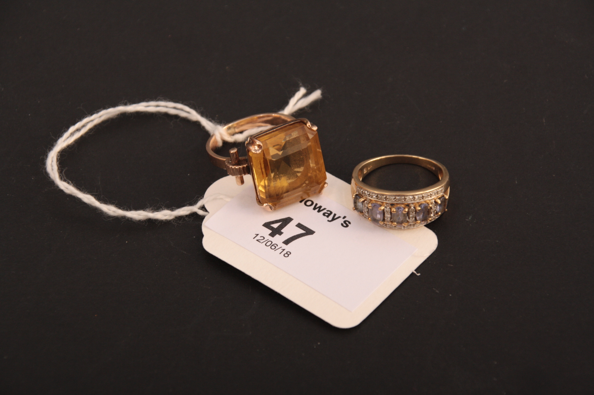 A single stone citrine dress ring, the rectangular cut cornered citrine in raised claw mount to