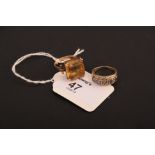 A single stone citrine dress ring, the rectangular cut cornered citrine in raised claw mount to