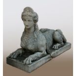 An early 20th century established reconstituted gritstone classical female sphinx, with large