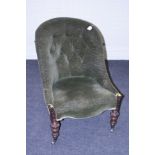 A Victorian button backed nursing chair with turned rosewood supports