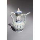 A Chinese blue and white porcelain ewer and cover, painted with an official seated at a tea table