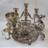 A large quantity of silver plate, including an ice bucket, a candelabrum, a salver, an egg cruet and