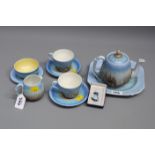 A 1930s Shelly Harmony 'Dripware' Tea for Two in shades of blue together with a Delft brooch