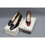 A pair of burgundy Bruno Magli court shoes together with a pair of black Bally low heel shoes