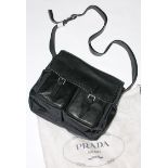 A Prada shoulder saddle bag, as new with certification