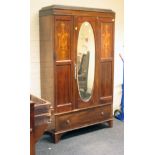 An Edwardian mahogany boxwood inlaid and strung single wardrobe, the caddy moulded cornice over a