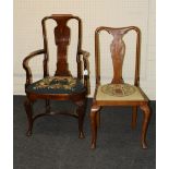 A George I style walnut open armchair with tapestry upholstered drop in seat, on scallop carved