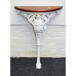 A Victorian cast iron console table, pierced decorated with Britannia and shield, terminating in a