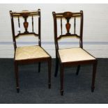 A pair of Edwardian mahogany boxwood inlaid and strung bedroom chairs, each having pierced urn