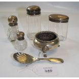 A silver plated caddy spoon with scallop bowl, a silver cauldron form salt and four silver capped