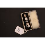 A pair of Edwardian enamel and mother of pearl cufflinks, circular with cabochon sapphires to