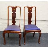 A set of four Edwardian beech Queen Anne style dining chairs, each with drop-in seat on cabriole