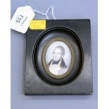 An early 19th century oval portrait miniature on ivory, of a gentleman in formal attire, 6 x 4.5cm