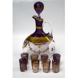 A Victorian graduated amethyst glass liqueur set, including a flagon form decanter and stopper and