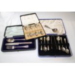 A cased set of six silver and enamel coffee spoons, two tone blue enamel terminals, Birmingham 1935,