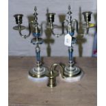 A pair of 19th century French champleve enamel decorated brass twin branch table candlesticks,