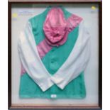 A framed and glazed set of jockey's racing silks, in the colours of Prince Khalid Abdulla, 84 x
