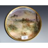 An early 20th century Royal Doulton plate, painted with a view of Linlithgow, signed J Hughes within