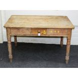 A Victorian stripped pine scrub top table, with single drawer, 122cm wide, together with two kitchen