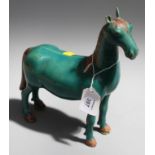 A Chinese copper green glazed porcelain figure of a horse in the Ming style with Manganese mane