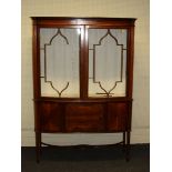 An Edwardian mahogany, boxwood inlaid and strung vitrine, the moulded break bow fronted cornice over