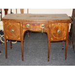 A George III mahogany satinwood crossbanded and inlaid sideboard of small proportions, the bow front