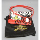 A Vivienne Westwood Anglomania handbag, black, red and yellow with red strap and dust bag