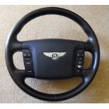 Bentley Continental GT steering wheel, unused, trimmed in black leather, complete with electrical