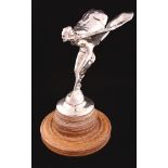A Spirit of Ecstasy sterling silver Queen's Jubilee 1977 mascot on a wooden plinth