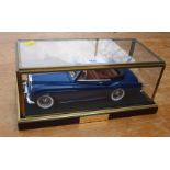 A scale diecast model of a Rolls-Royce Silver Cloud MkII drophead, with metallic blue coachwork in a