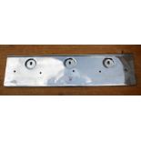 A specially produced extra heavy quality chromium plated solid steel front number plate backing