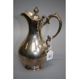 E.M. a silver hot water jug, of baluster form with bud finial and scrolled handle, Edinburgh 1867,
