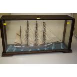 A circa 1920s scratch built model of a four masted clipper in full sail, in a period oak glazed