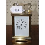 A 20th century 30 hour gilt brass carriage timepiece with bale handle