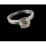 A single stone diamond ring, the brilliant cut diamond in four claw mount, to closed back setting