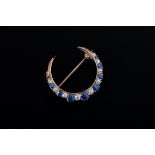 A late Victorian sapphire and diamond crescent brooch, the graduated mixed old cut stones in