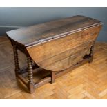 A basically 18th century oak gateleg dining table, the pegged rectangular top with demi-lune flaps